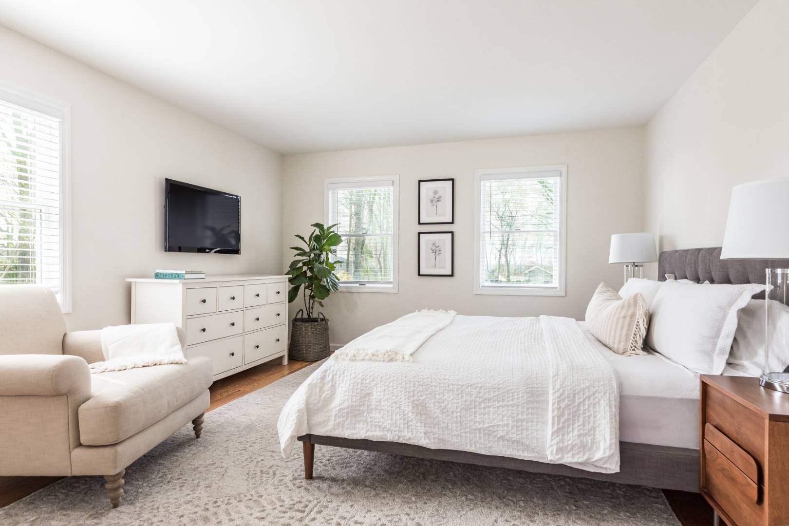 2 Bayview Road Southampton, NY 11968 - Photo 6 of 17 a bedroom with a bed and flat screen tv