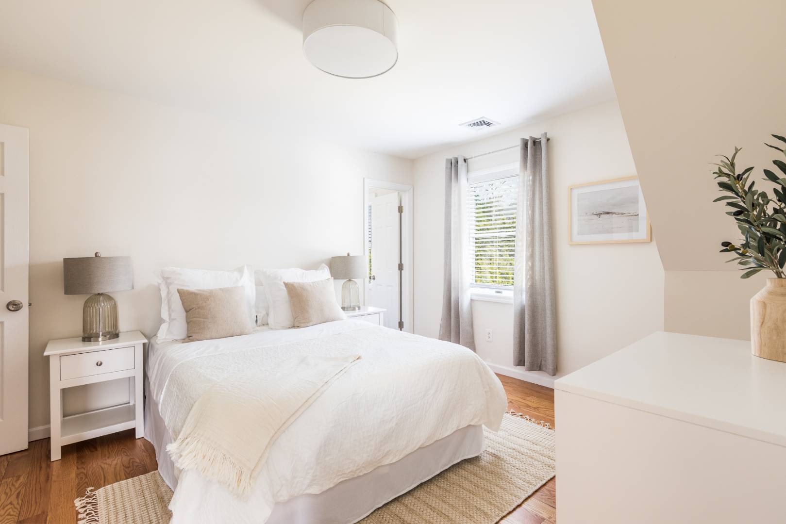 2 Bayview Road Southampton, NY 11968 - Photo 7 of 17 a bedroom with a bed and wooden floor