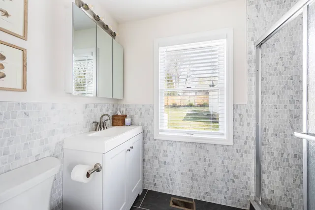 a bathroom with a sink a toilet and a bathtub