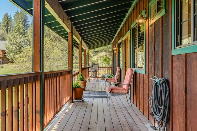a view of living room and dining room with wooden floor