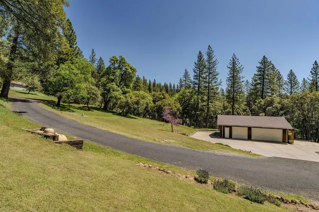 a kitchen with stainless steel appliances a sink and a large window