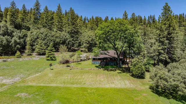 a view of a house with a swimming pool