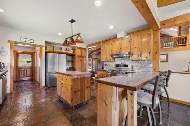 a bathroom with a bathtub and shower