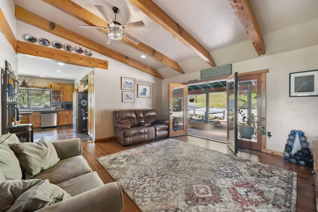 an aerial view of a house with a yard