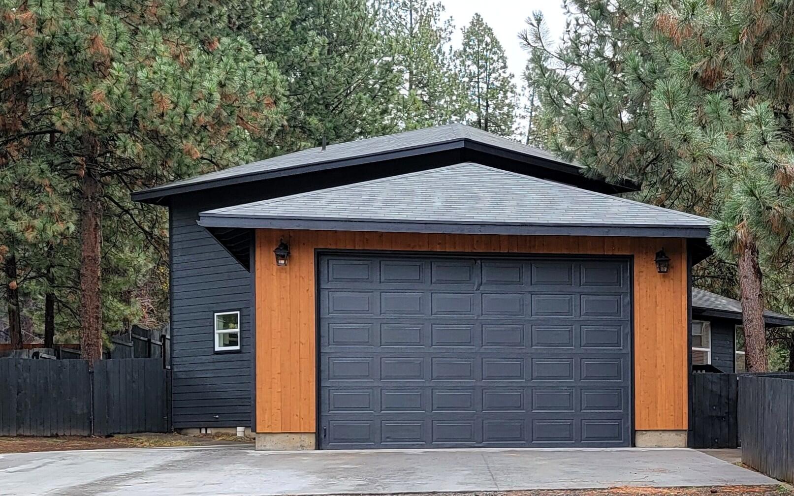 19263 Indian Summer Road Bend, OR 97702 - Photo 1 of 32 a front view of a house with garage
