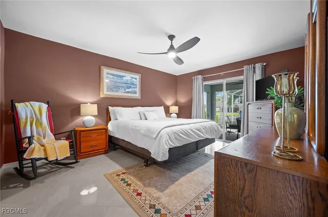 a bedroom with bed and glass door