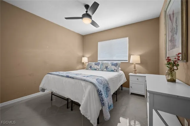 a bedroom with a bed and a table