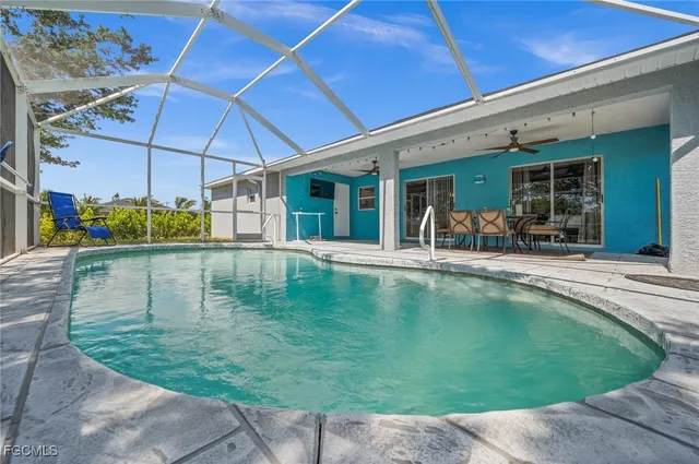 a view of a swimming pool with a patio