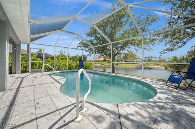 a view of a swimming pool with a lounge chairs