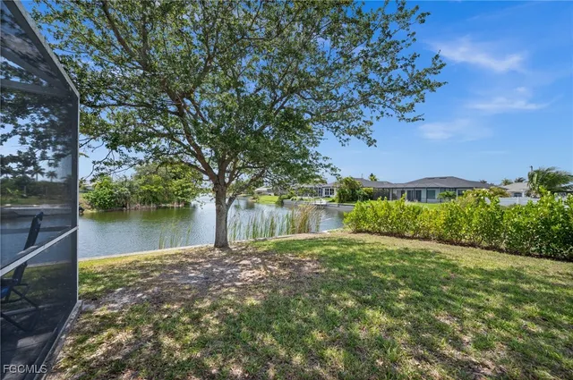 a view of a lake with a house in the background