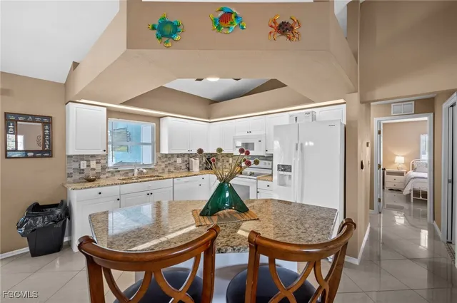 a very nice looking dining room with a table and chairs