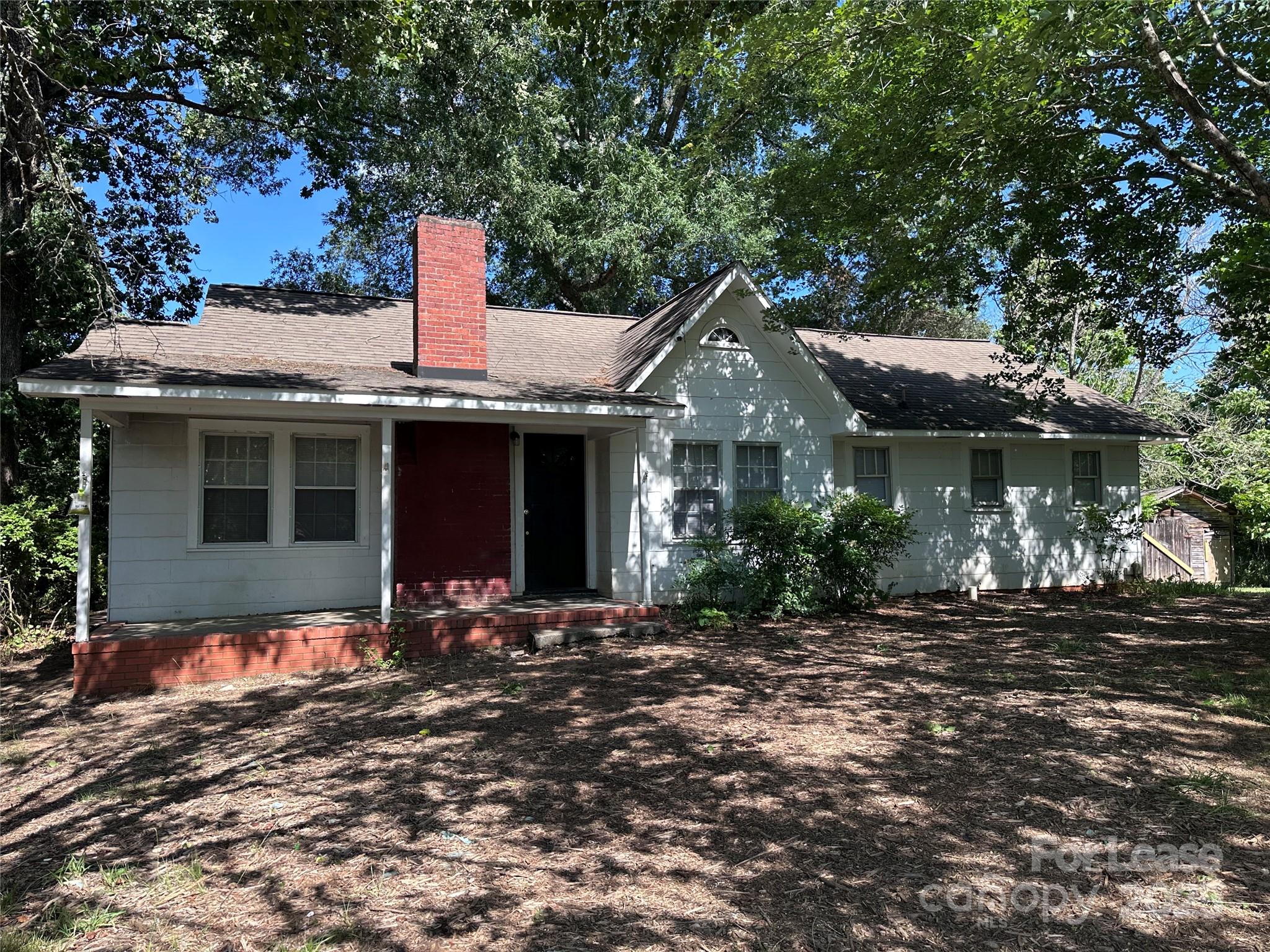9155 601st Highway Midland, NC 28107 - Photo 1 of 14 a front view of a house with a yard