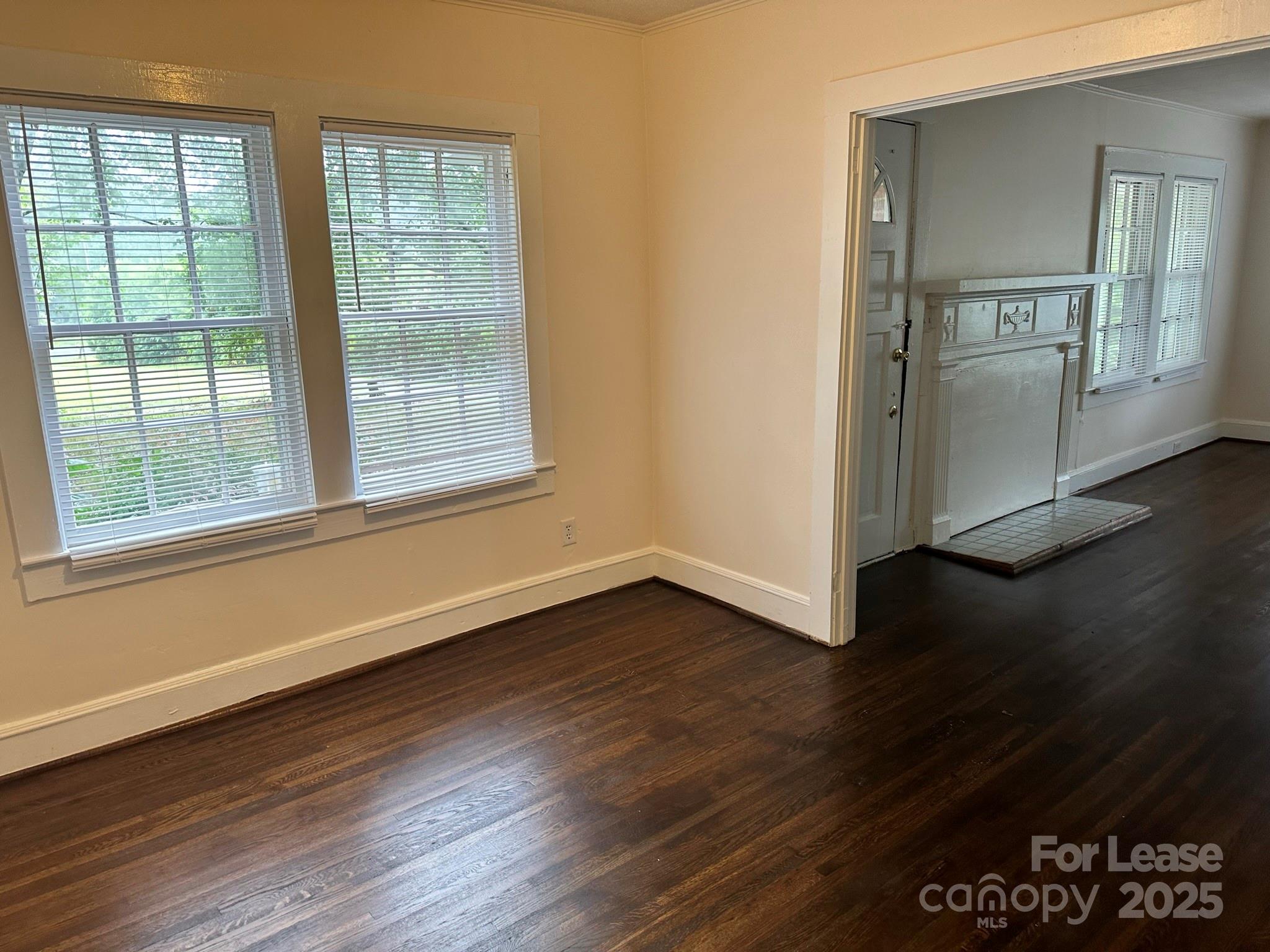 9155 601st Highway Midland, NC 28107 - Photo 3 of 14 a view of an empty room with wooden floor and a window