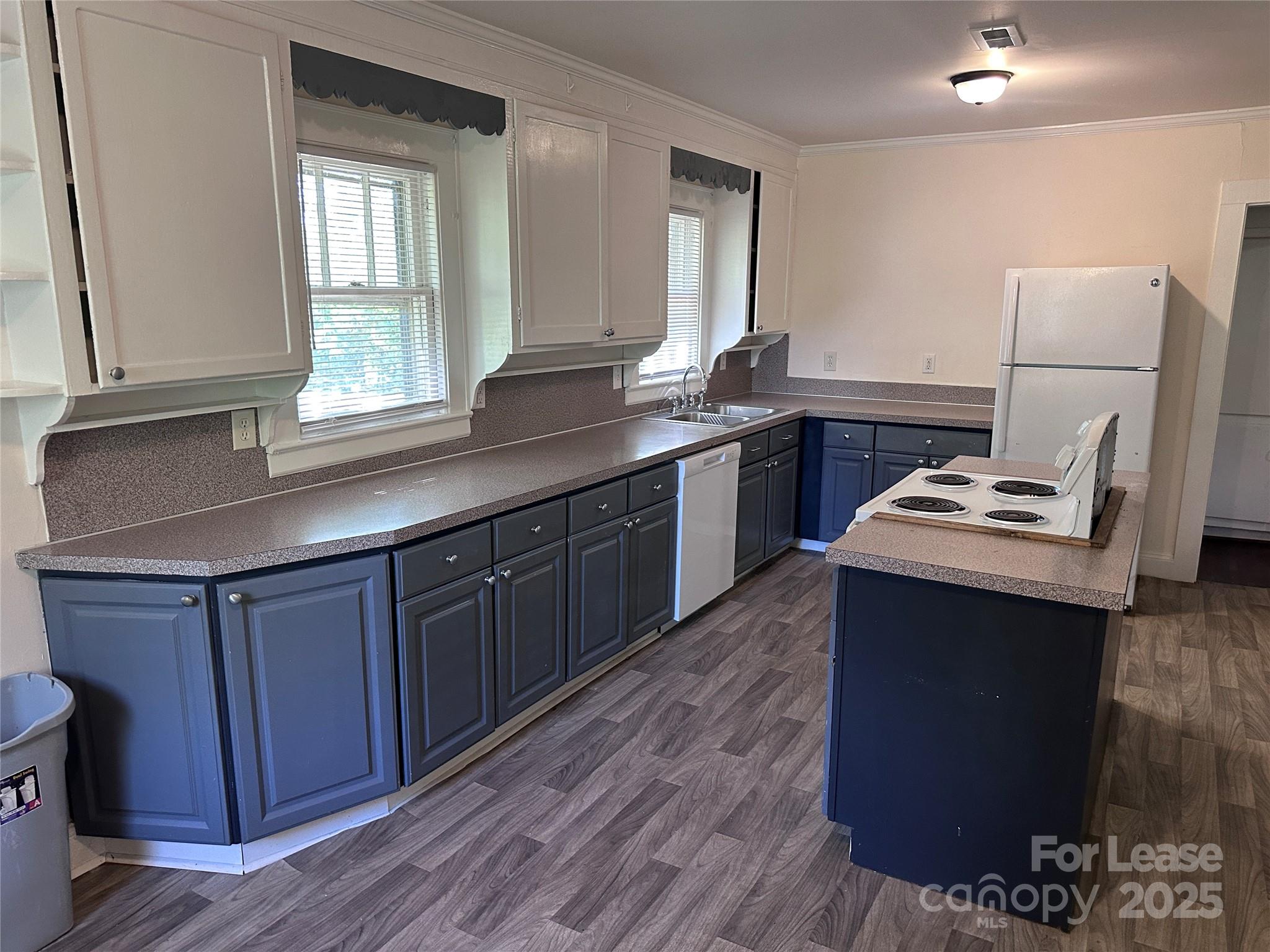 9155 601st Highway Midland, NC 28107 - Photo 4 of 14 a kitchen with a sink cabinets and wooden floor