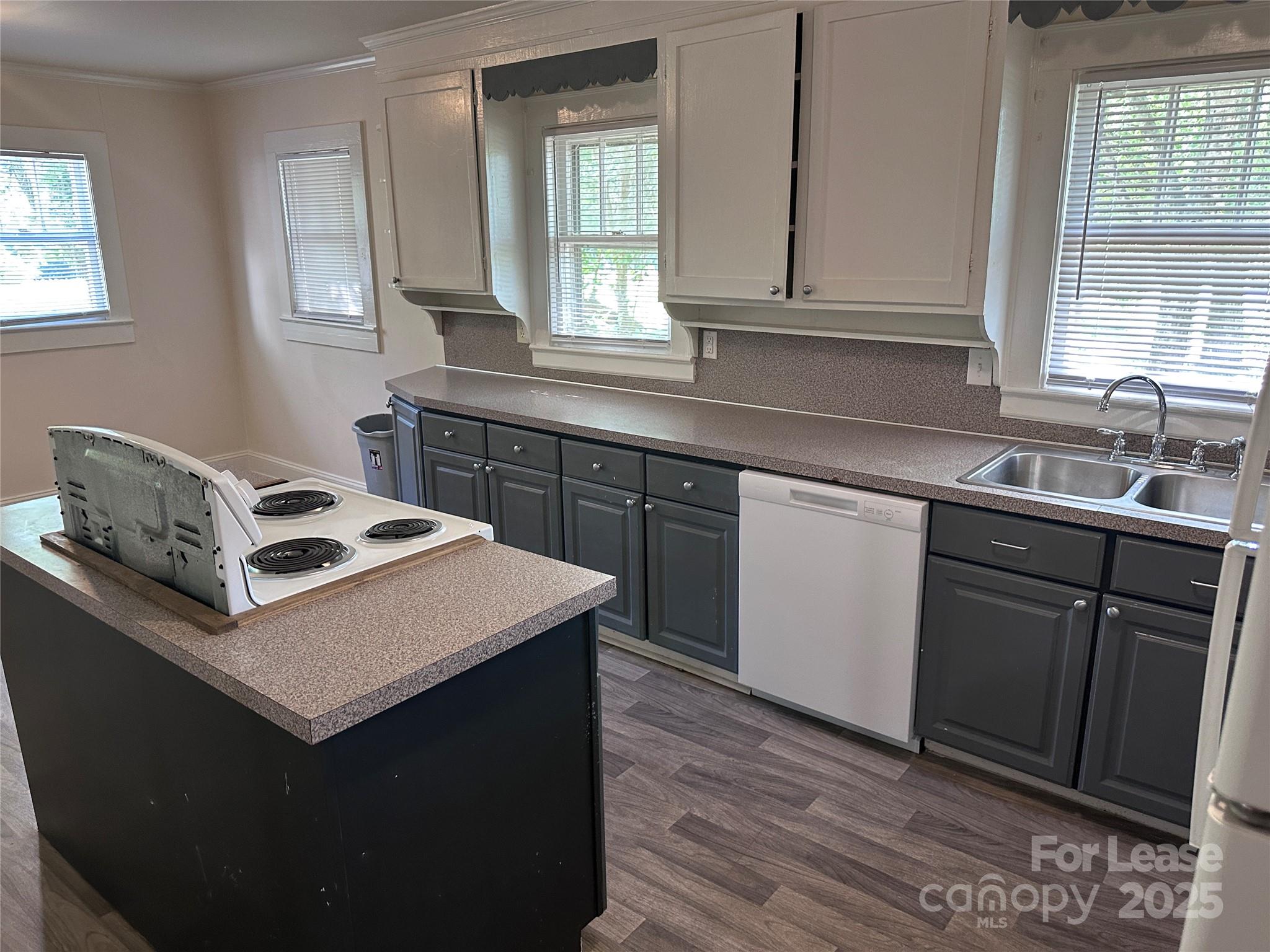 9155 601st Highway Midland, NC 28107 - Photo 5 of 14 a kitchen with a sink stove and cabinets