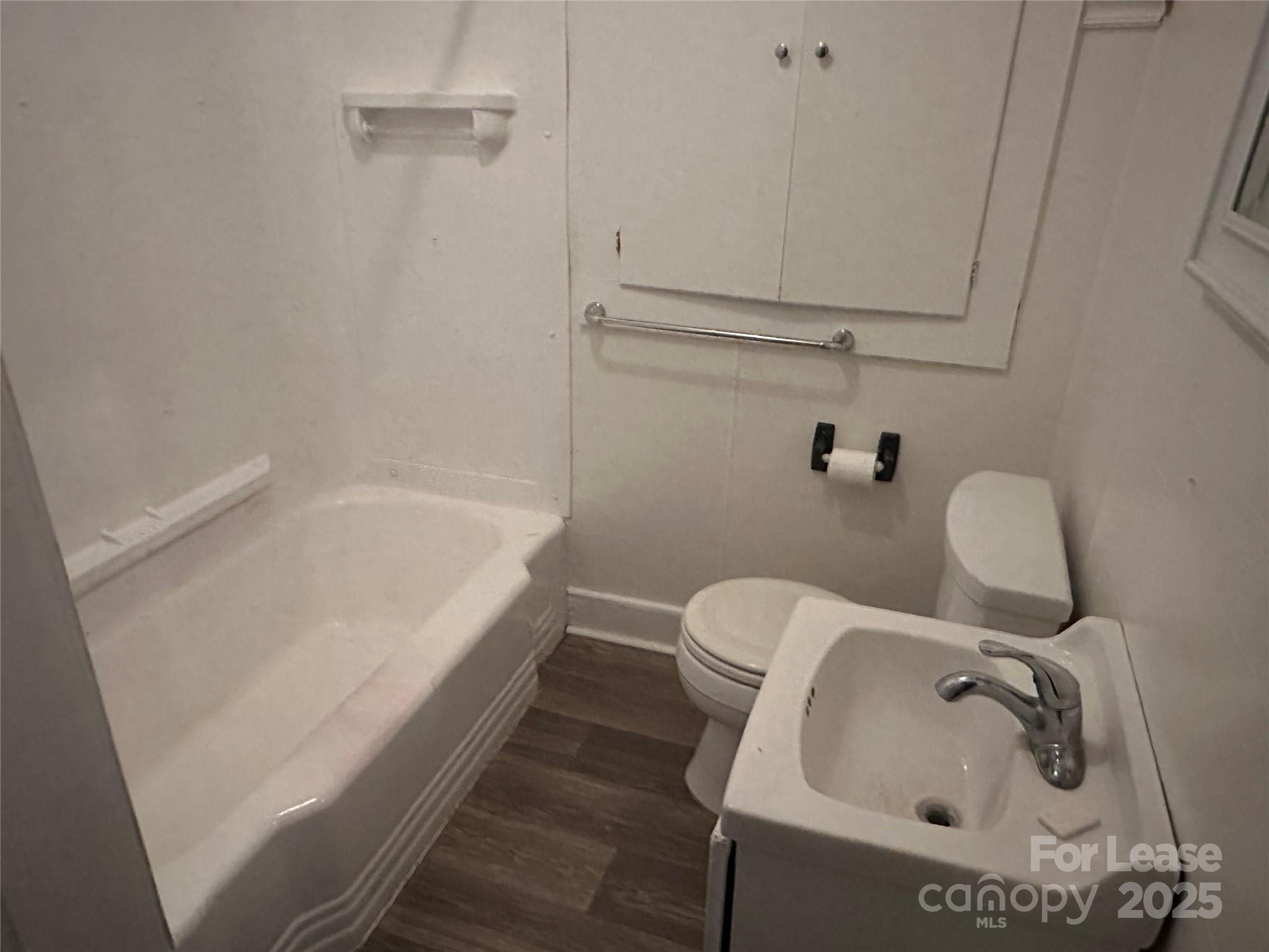 9155 601st Highway Midland, NC 28107 - Photo 10 of 14 a bathroom with a sink and bathtub