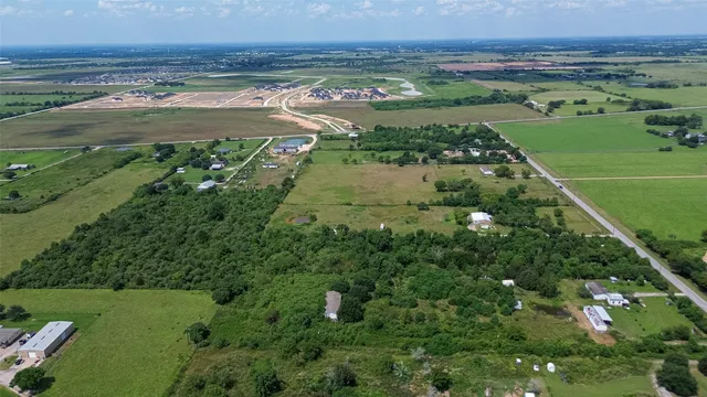 an aerial view of a houses with outdoor space and river view