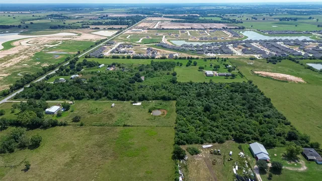 an aerial view of a residential houses with outdoor space