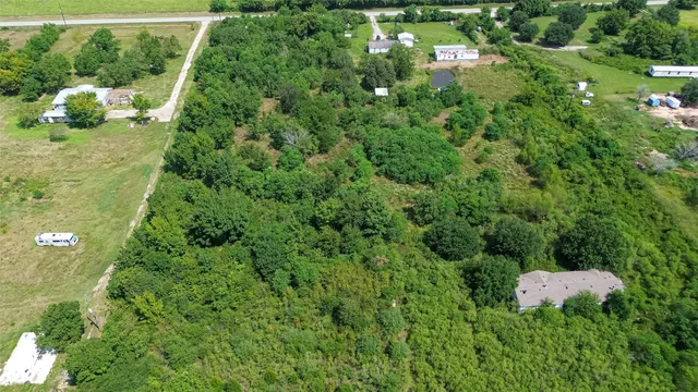 a view of a lake with a yard