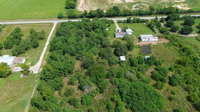 an aerial view of residential house with outdoor space