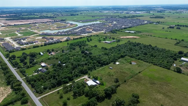 an aerial view of a yard with green space