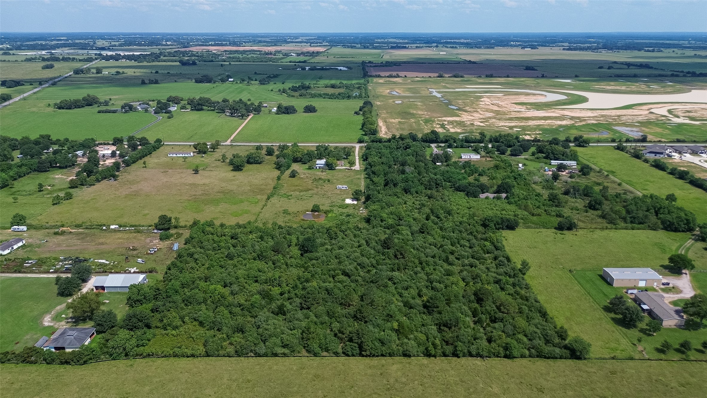 0 Knebel Road Waller, TX 77484 - Photo 10 of 36 an aerial view of a houses with outdoor space and a lake view