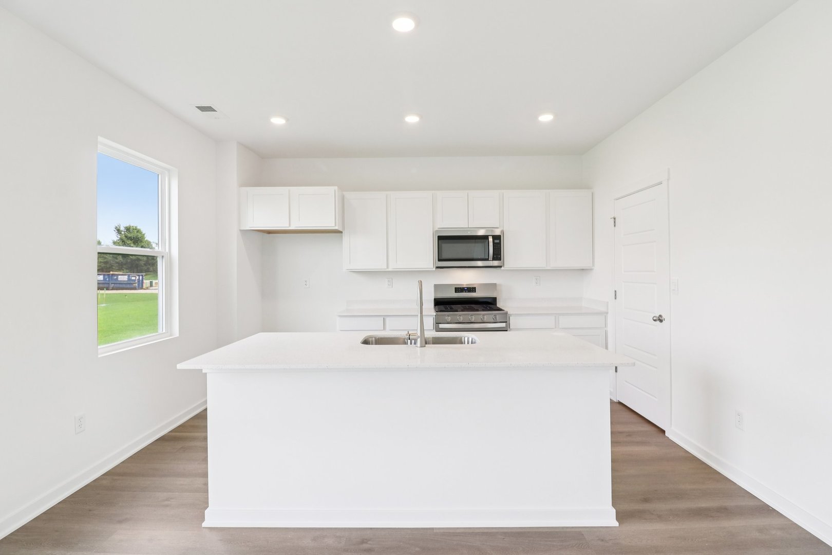 9956 Edgebrook Lane Huntley, IL 60142 - Photo 9 of 29 a kitchen with stainless steel appliances a refrigerator sink and microwave