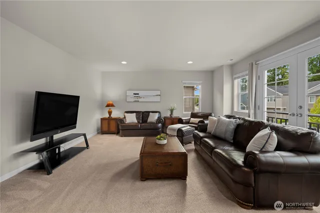 a backyard of a house with barbeque oven table and chairs