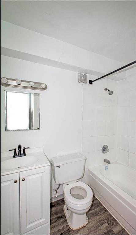 916 Isbell Road, Unit D Fort Worth, TX 76114 - Photo 12 of 13 a bathroom with a granite countertop sink toilet and shower