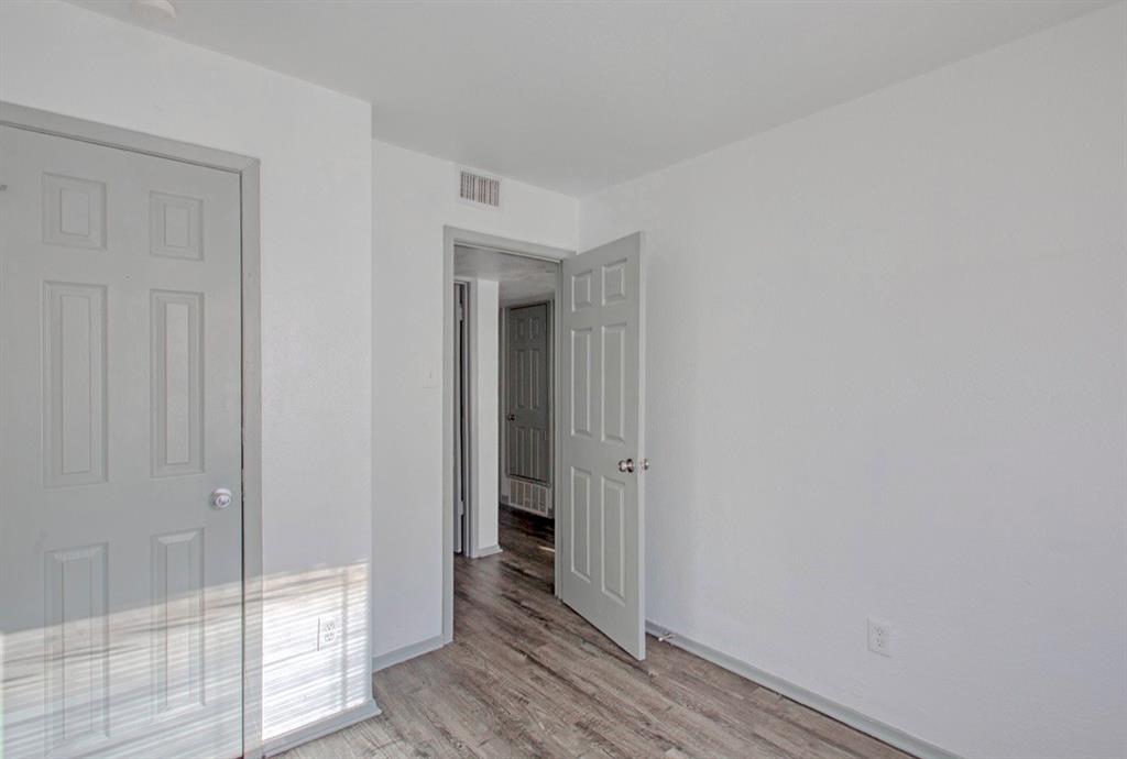 916 Isbell Road, Unit D Fort Worth, TX 76114 - Photo 10 of 13 a view of a hallway with wooden floor
