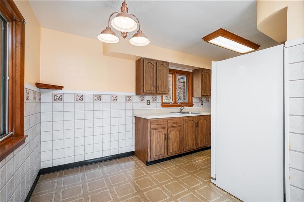 7510 Noblestown Road McDonald, PA 15057 - Photo 6 of 20 a bathroom with a sink a mirror and a light fixture