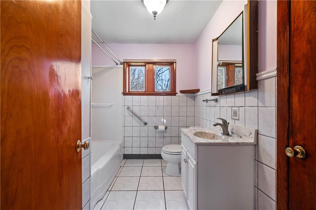 7510 Noblestown Road McDonald, PA 15057 - Photo 10 of 20 a bathroom with a sink and a mirror
