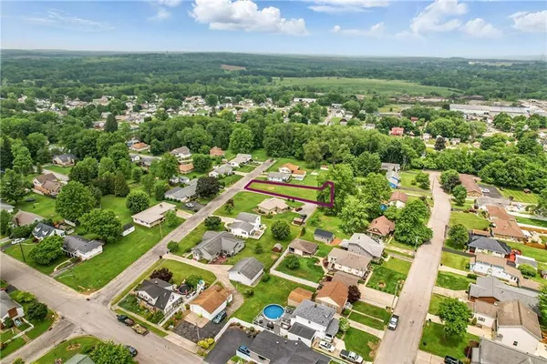 an aerial view of a residential houses with outdoor space