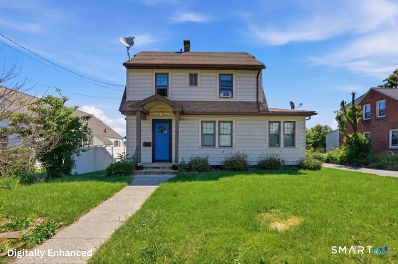 443 Highland Avenue Waterbury, CT 06708 - Photo 1 of 24 a front view of a house with a yard