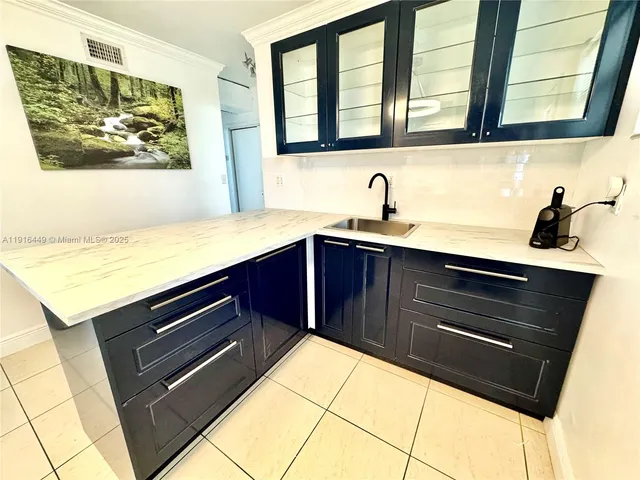 a kitchen with a sink and a stove