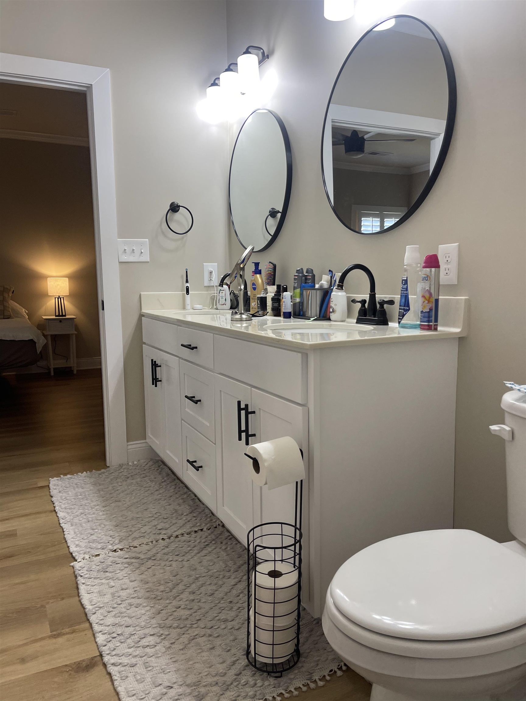 210 Church Street Ripley, TN 38063 - Photo 12 of 21 Bathroom featuring double vanity, connected bathroom, and light wood-style floors