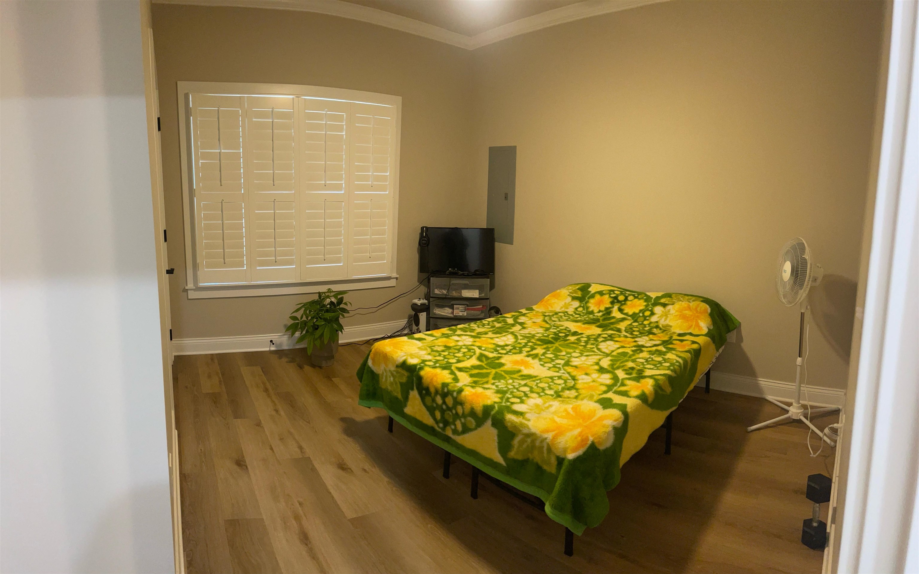 210 Church Street Ripley, TN 38063 - Photo 15 of 21 Bedroom with wood finished floors, ornamental molding, and electric panel