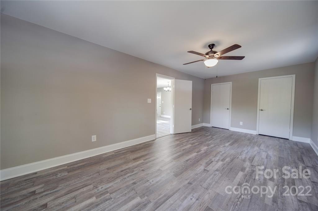 1149 Long Pine Church Road Peachland, NC 28133 - Photo 11 of 27 a view of an empty room with a window and a ceiling fan