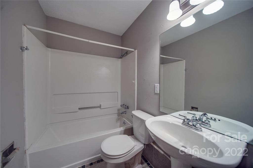 1149 Long Pine Church Road Peachland, NC 28133 - Photo 14 of 27 a bathroom with a granite countertop sink toilet and shower