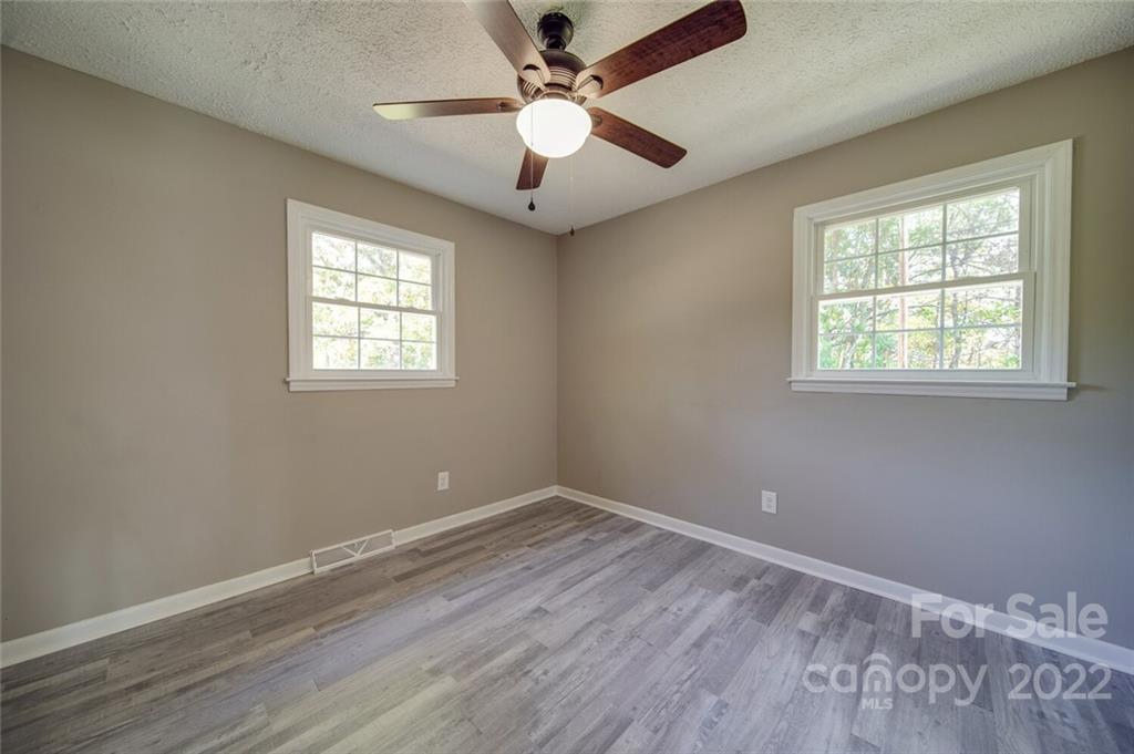1149 Long Pine Church Road Peachland, NC 28133 - Photo 17 of 27 wooden floor in an empty room with a window