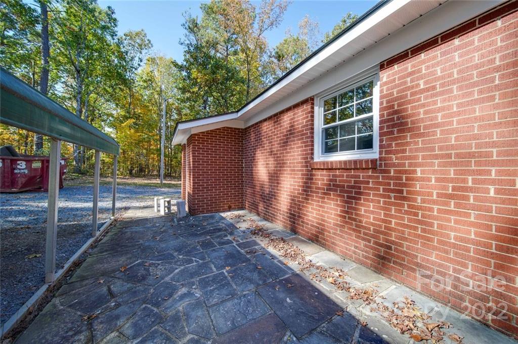 1149 Long Pine Church Road Peachland, NC 28133 - Photo 21 of 27 a view of backyard with wooden fence and large trees