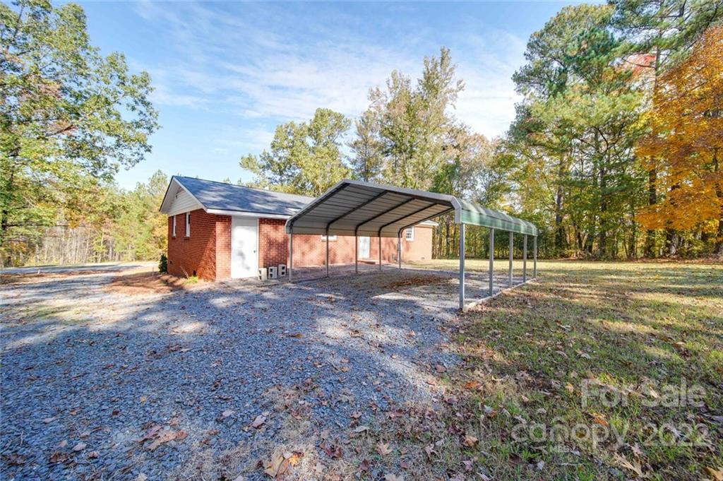 1149 Long Pine Church Road Peachland, NC 28133 - Photo 22 of 27 a backyard of a house with lots of green space