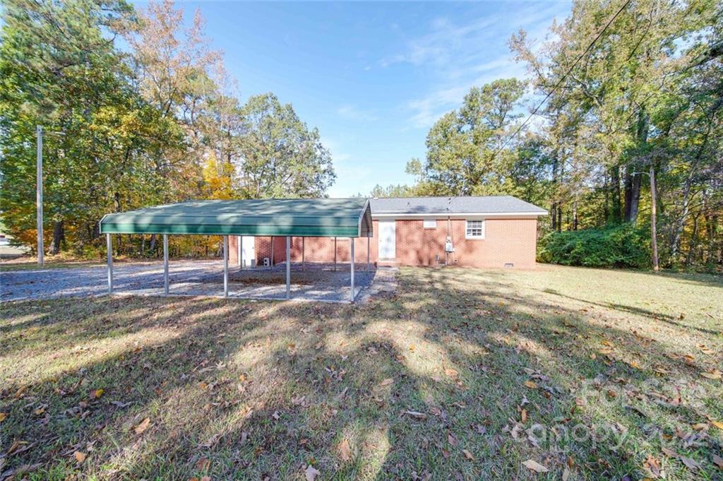 1149 Long Pine Church Road Peachland, NC 28133 - Photo 4 of 27 a view of a yard with a tree