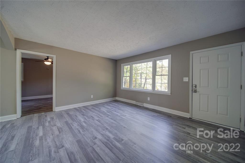 1149 Long Pine Church Road Peachland, NC 28133 - Photo 9 of 27 wooden floor in an empty room with a window