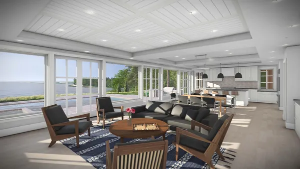 a living room with furniture a flat screen tv and large windows