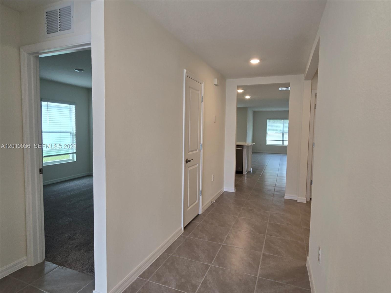 9871 Southeast 161st Lane Road Summerfield, FL 34491 - Photo 6 of 31 a view of a hallway with wooden shelves