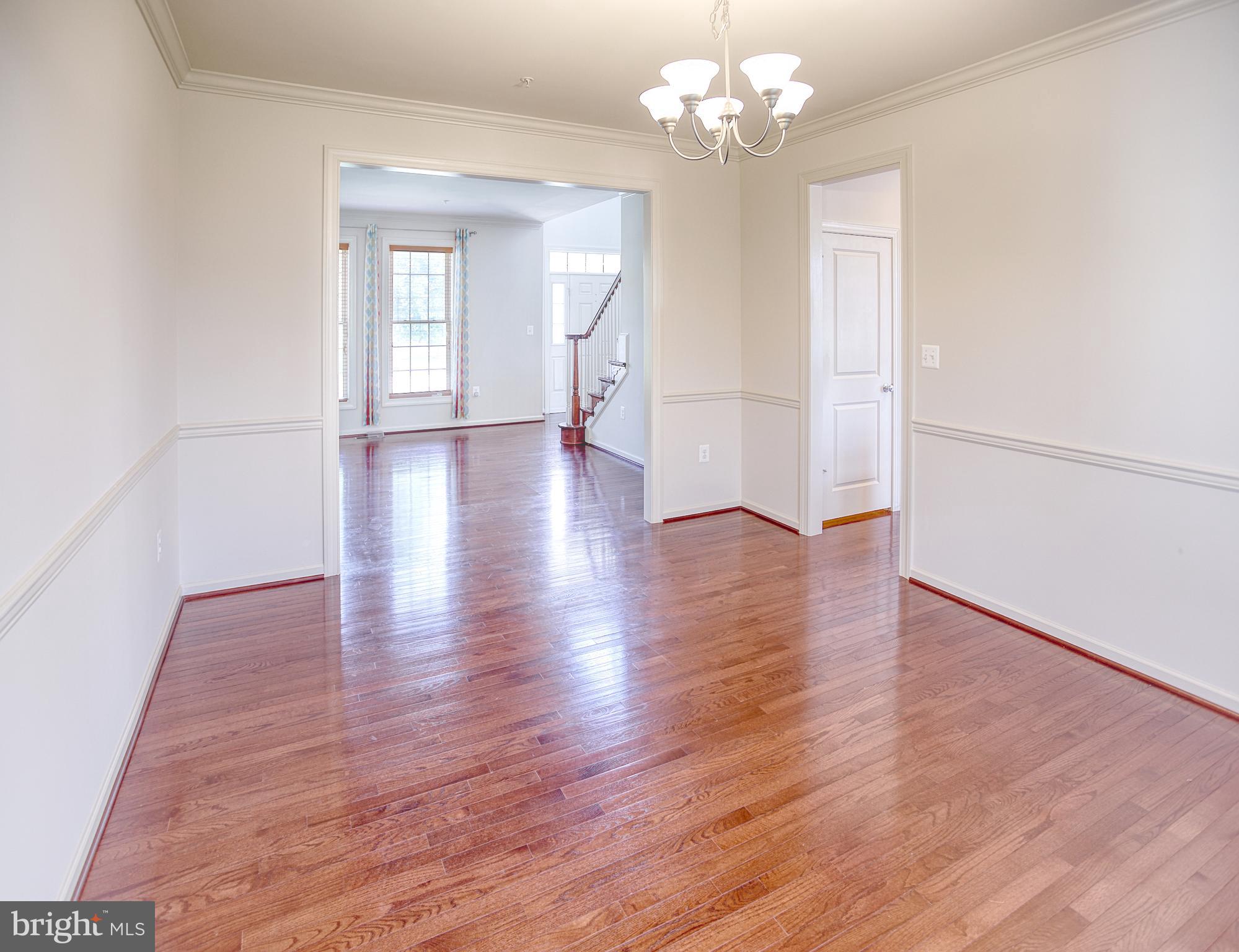 13336 Redspire Drive Silver Spring, MD 20906 - Photo 13 of 66 wooden floor in an empty room with a window