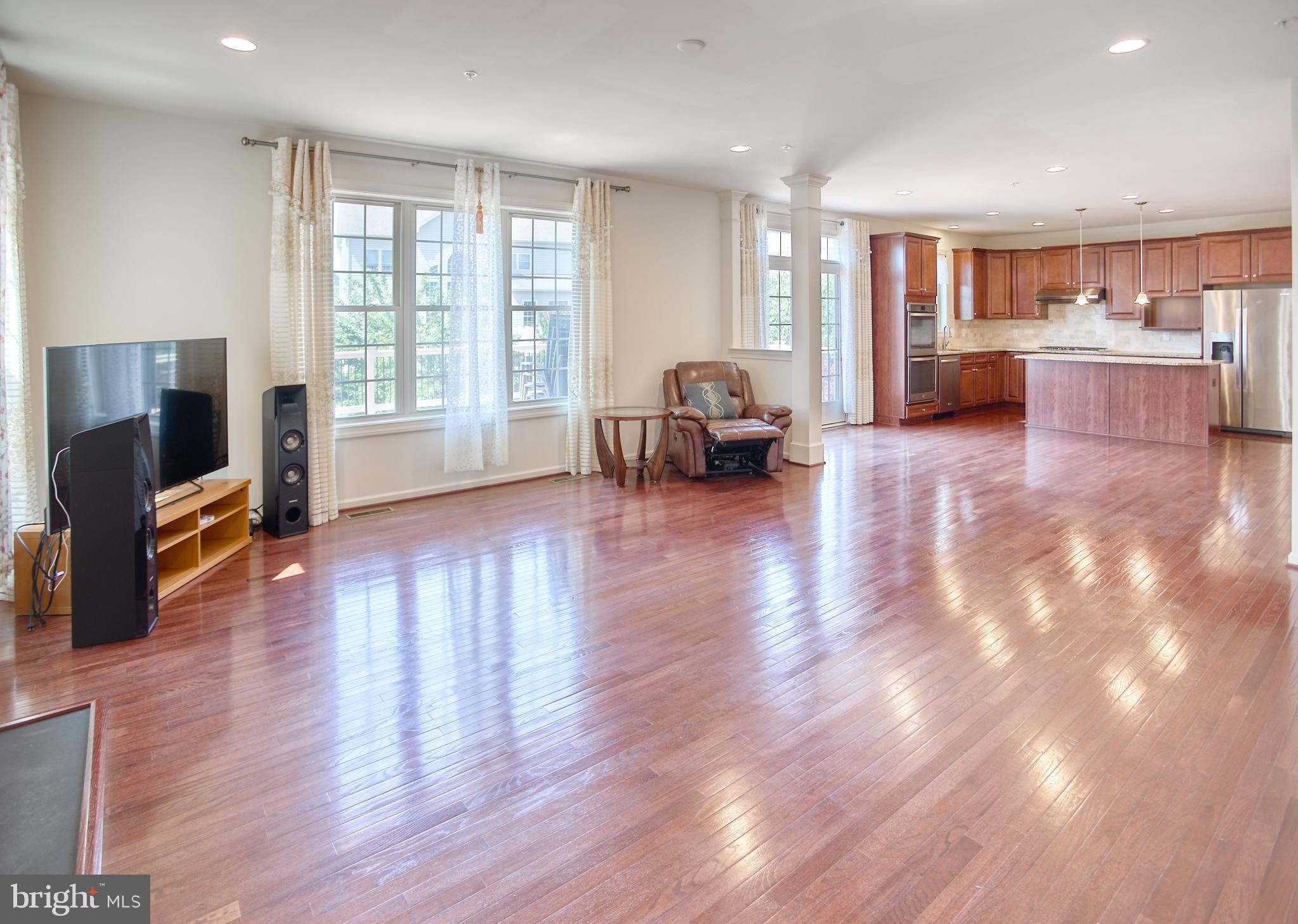 13336 Redspire Drive Silver Spring, MD 20906 - Photo 19 of 66 a living room with furniture and a flat screen tv