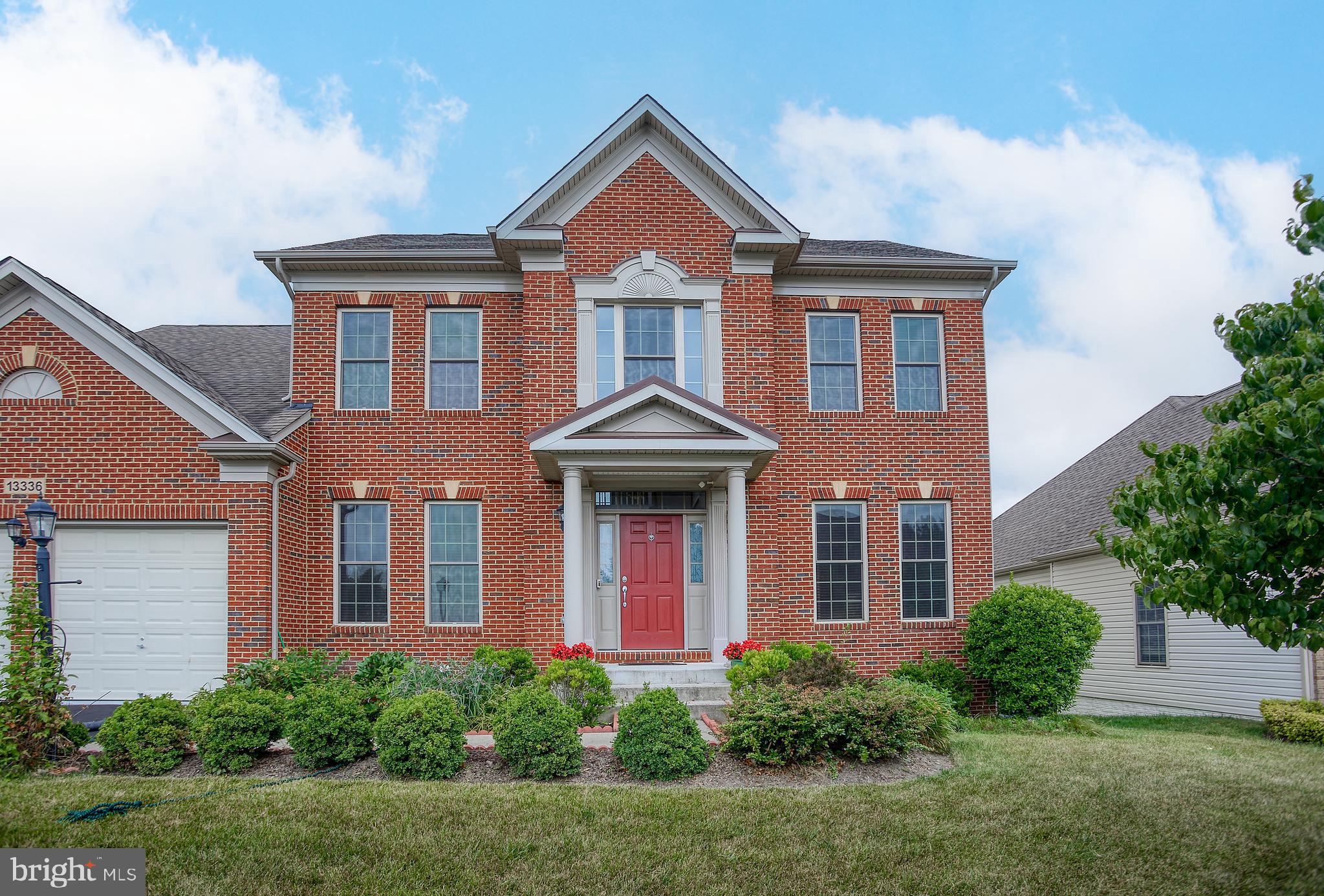 13336 Redspire Drive Silver Spring, MD 20906 - Photo 2 of 66 front view of a house with a yard
