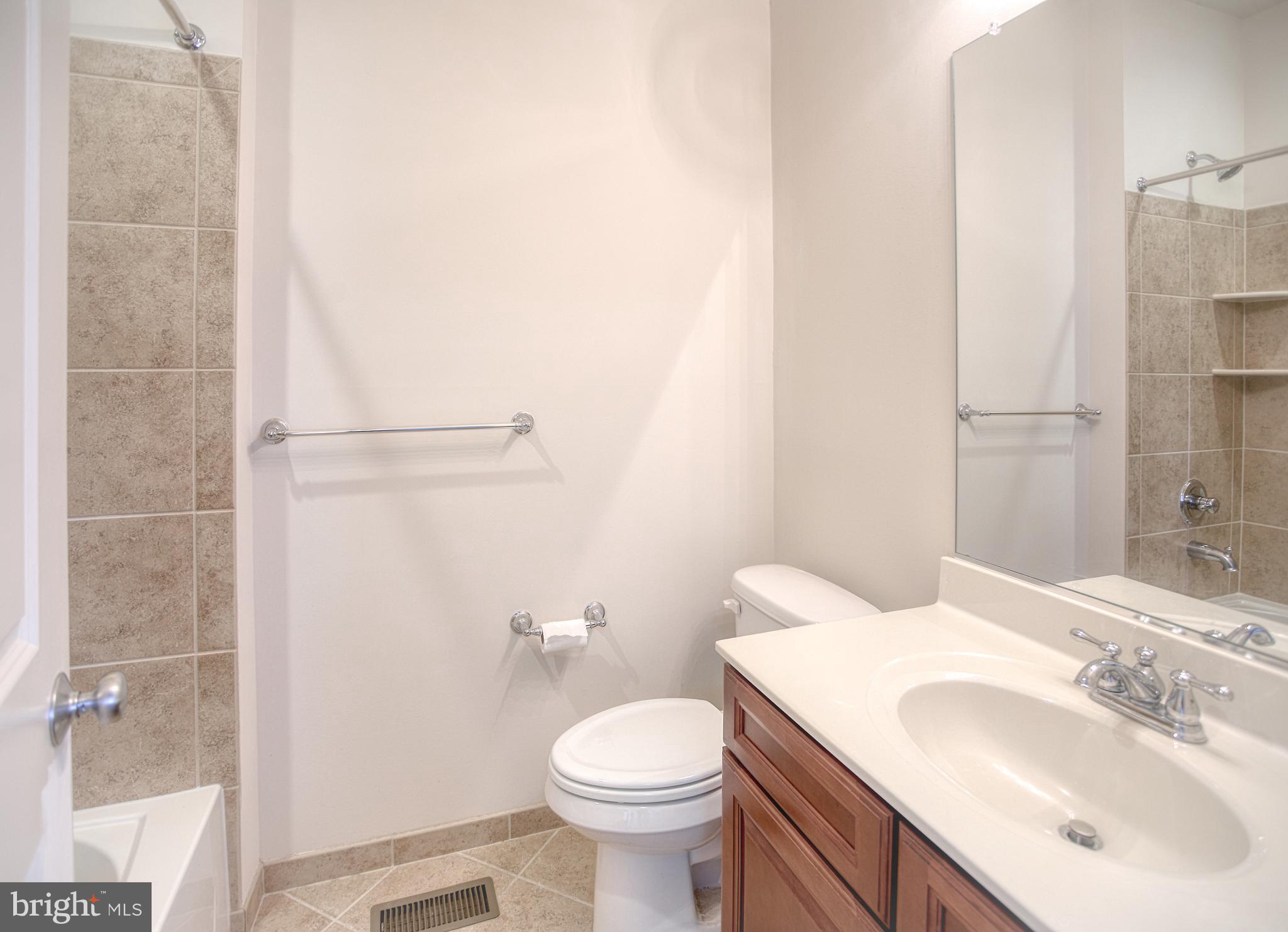 13336 Redspire Drive Silver Spring, MD 20906 - Photo 31 of 66 a bathroom with a sink toilet and shower